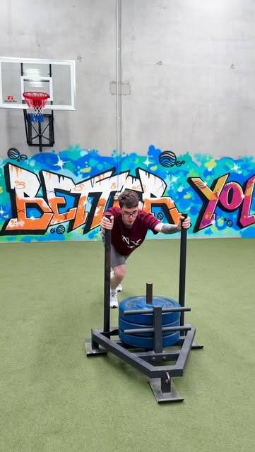 Client doing a sled push session at Moore Movement Personal Training